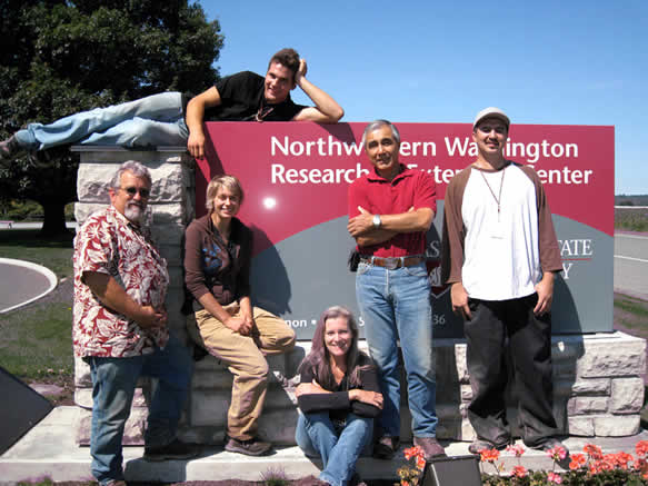 Entomology program staff pose with the NWREC sign.