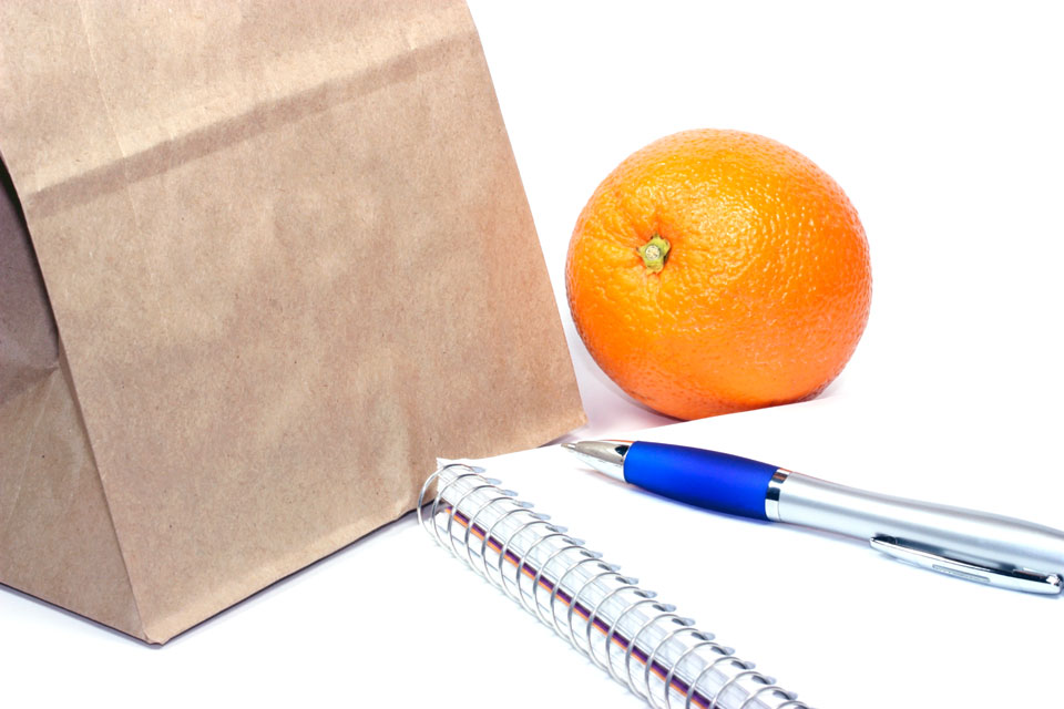 Lunch bag with notepad and pen.