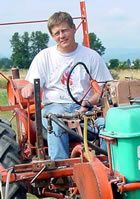 Mike driving a tractor